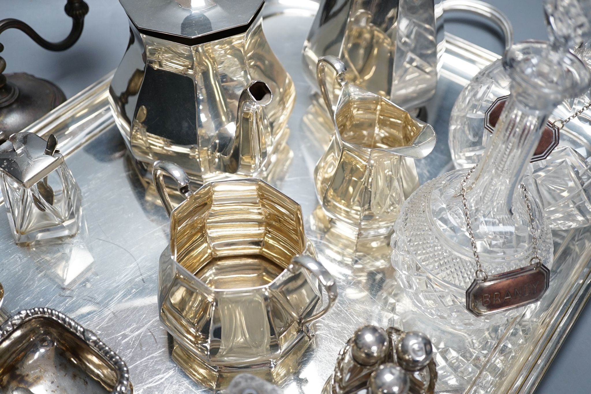 A quantity of silver plated tea/coffee wares including two handled tray, decanters, salts etc., 62cm